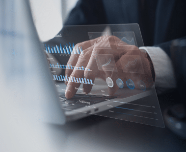 OCR for Automatic Data Extraction Digital icons representing different data points overlaid on an image of a person typing on a laptop.